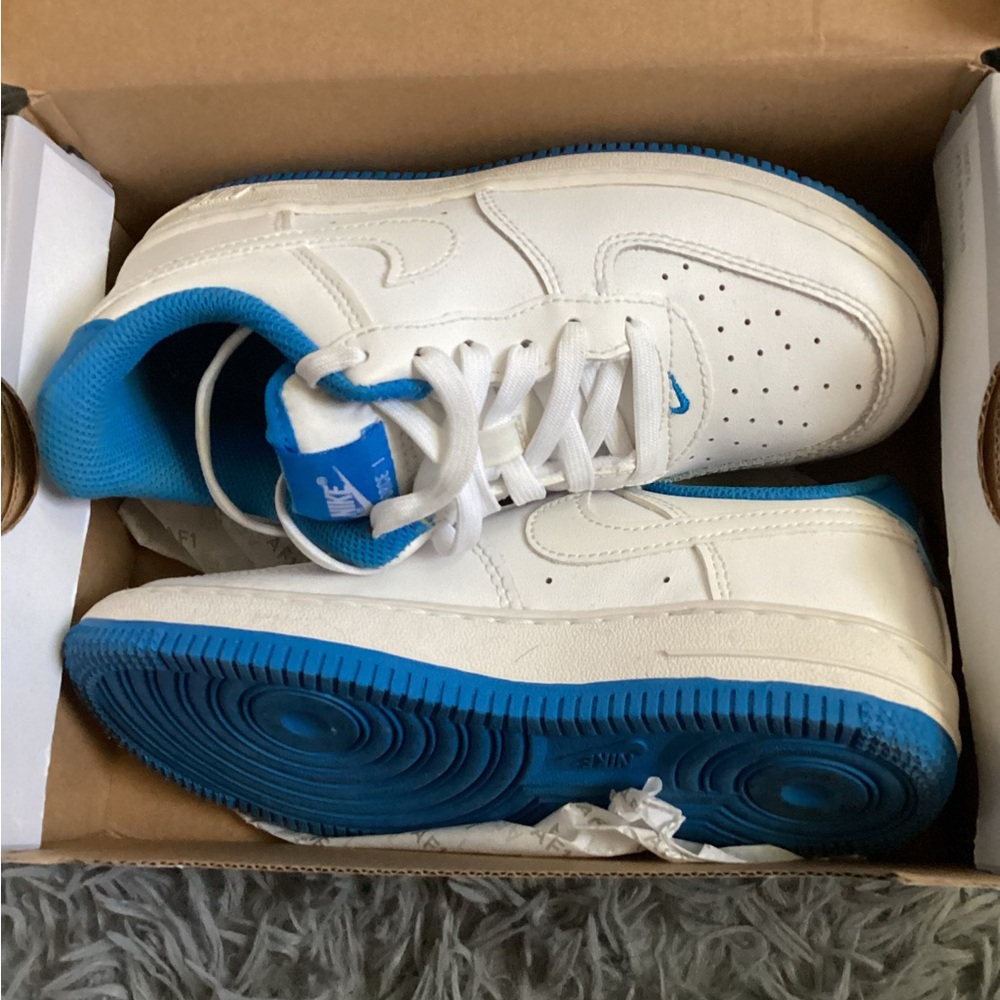 White and Blue Nike Sneakers.